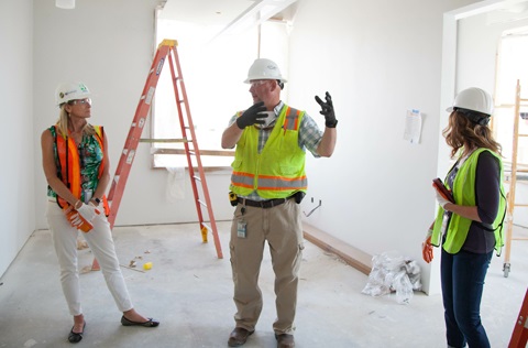 Contractor discusses an interior home remodel with City staff