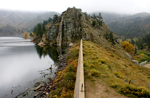 Reservoir and hills on foggy day