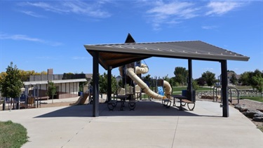 A sheltered park pavilion on a sunny day