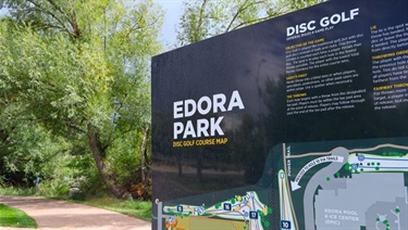 A sign for Edora Park's Disc Golf course