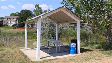 A small shelter with a picnic table