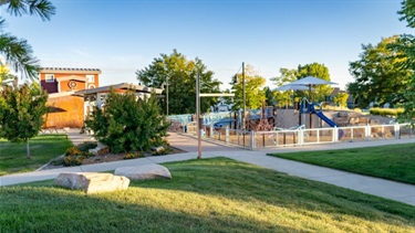 A park playground surrounded by trees