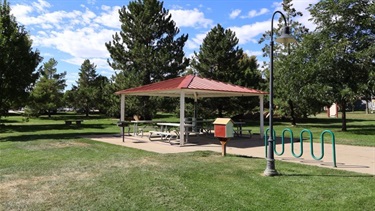 A small covered pavilion with picnic tables
