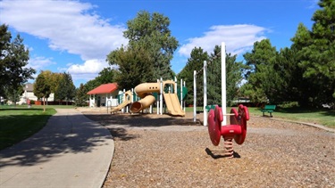 A park playground with slides and swings