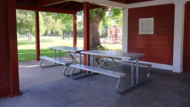 Picnic tables under a covered pavilion