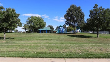 A park playground at the top of a hill