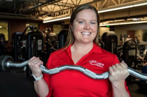 Portrait photo of Rheannon Nelson in a weight room