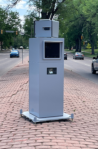 mobile camera radar unit positioned within a roadway brick median