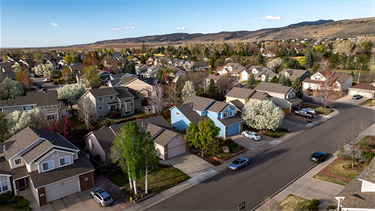 aerial of street with dense homes