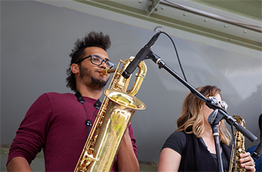 musicians play sax on stage