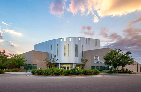 museum building with dramatic clouds